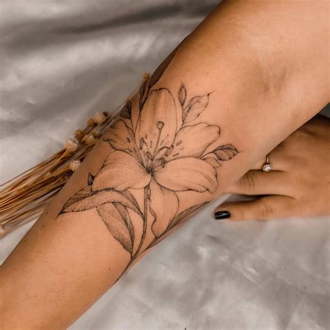 Lily Flower Tattoo Placed Onm The Forearm Illustrative