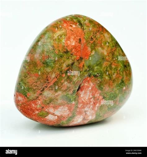 Macro close up colour photograph of a polished "Unakite" a semi ...