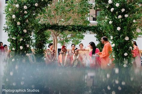 Indian bride is gifted a red dot on forehead during wedding ceremony ...