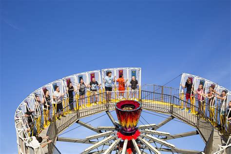 Round Up is an amusement ride consisting of a circular horizontal platform with a vertical cage ...