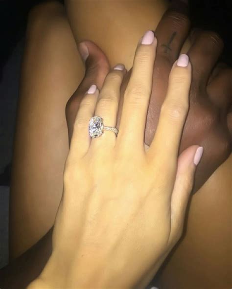 A Woman S Hand With A Diamond Ring On It