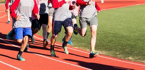 Cross Country Boys Team Running Fast On A Track In Spikes Stock Image