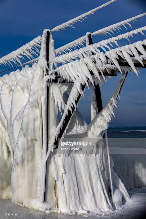 The St Joseph Lighthouse Is Seen Frozen Over From Recent Frigid