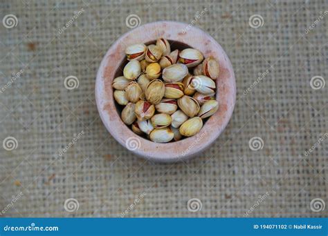 Pistachios With Salt Roasted In Small Wood Bowl Texture Textile Slate