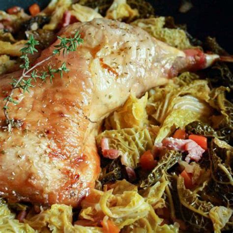 A Close Up Of A Chicken And Vegetables In A Skillet