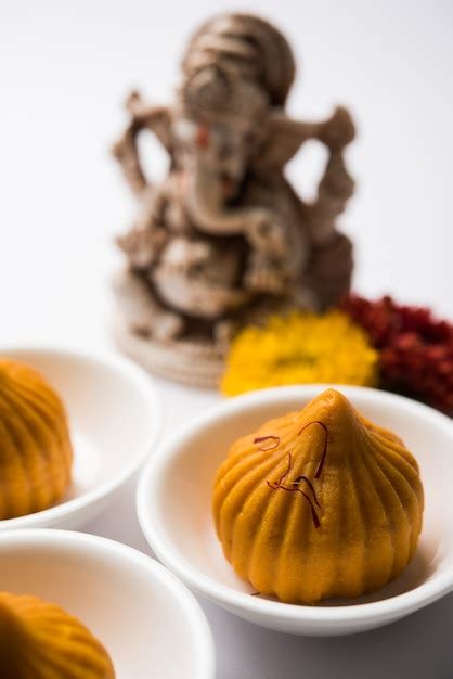 Premium Photo Sweet Modak Food Offered While Ganapati Pooja Or Ganesh