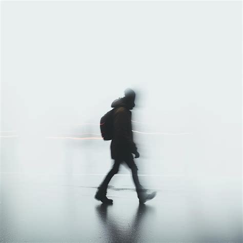 Person walking on white background motion blur | Premium AI-generated image