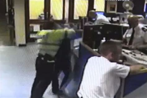 Shocking Video Shows Policeman Force Handcuffed Mans Head Onto Desk Mirror Online