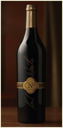 A Bottle Of Wine On A Table With A Gold Border Around The Top And Bottom