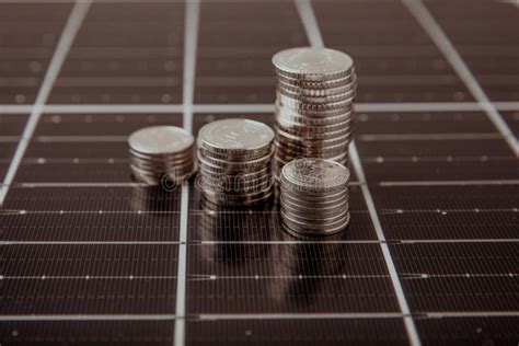 Solar Panel and Coins. Concept of Saving Money and Clean Energy Stock ...