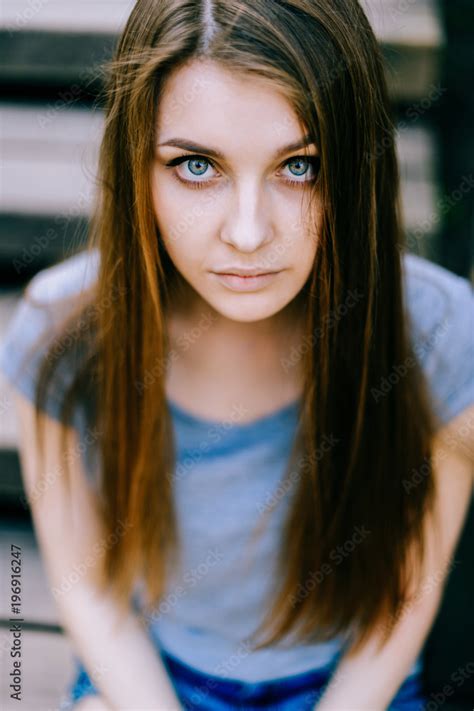 Brunette Teenage Girl With Blue Eyes