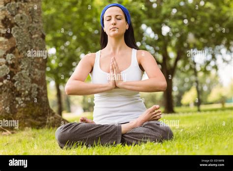 Brunette Sitting In Lotus Pose With Hands Together Stock Photo Alamy