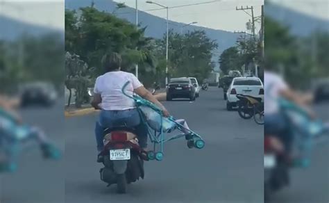 They Capture A Couple Traveling On A Motorcycle Complete With Stroller