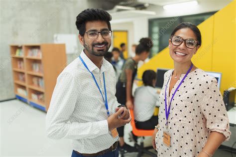 Portrait junior high teachers in library - Stock Image - F024/2555 - Science Photo Library