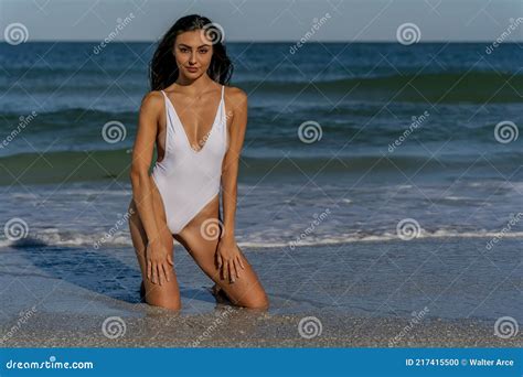 Lovely Mixed Race Bikini Model Posing Outdoors On A Caribbean Beach