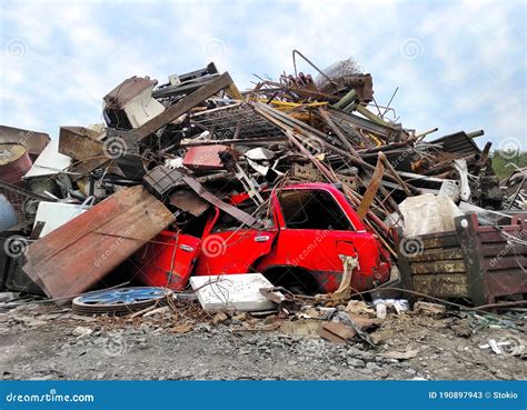 Retro Red Vehicle At Junk Yard Broken Steel Garbage Vintage