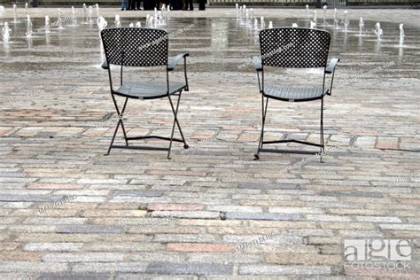 Two Empty Chairs At City Square Stock Photo Picture And Low Budget