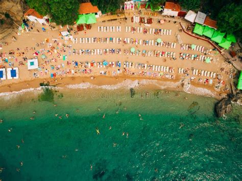 Top View Of Beach Aerial View Of Sandy Beach With Tourists Swim Stock