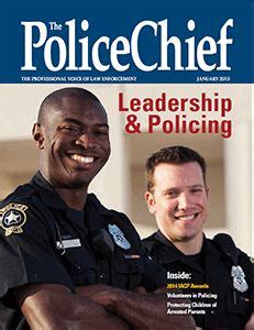 Two Police Officers Are Smiling On The Cover Of The Magazine S Latest