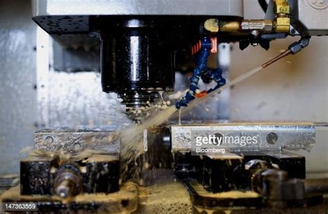 Coolant Is Sprayed On A Driil Bit In An Cnc Machine Creating A Part