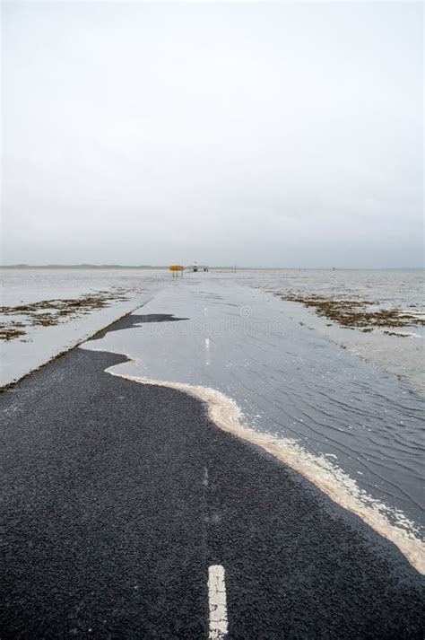 Road To Holy Island In England Flooded By The Sea At High Tide Stock