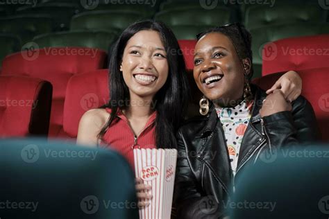 Couple of Black female audiences and lovers express emotion, watching