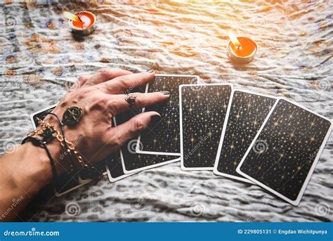 Show Fortune Tellers Of Hands Holding Tarot Cards And Tarot Reader With