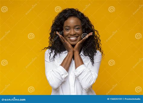 Emotional African American Woman Touching Her Cheeks Stock Image