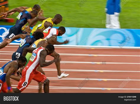 Athletes In Men's 100 Meter Sprint Stock Photo & Stock Images | Bigstock