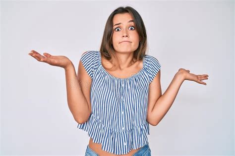 Beautiful Caucasian Woman Wearing Casual Striped Shirt Clueless And