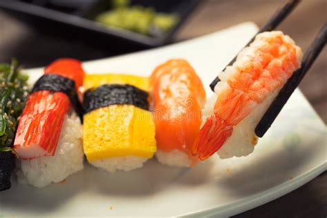 Close Up Of Sashimi Sushi Set With Chopsticks Stock Photo Image Of