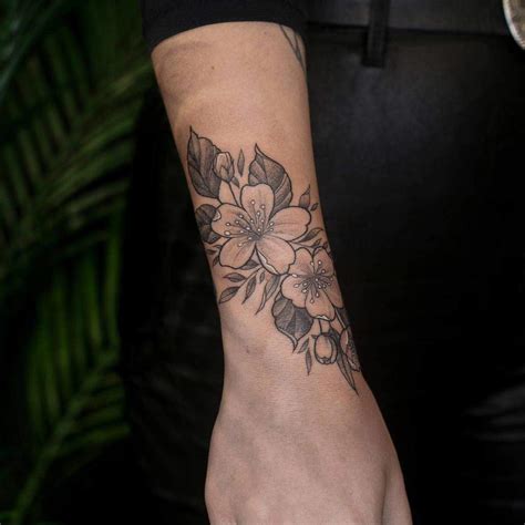 Elegant Flower Wrist Tattoo Ideas For A Delicate Look