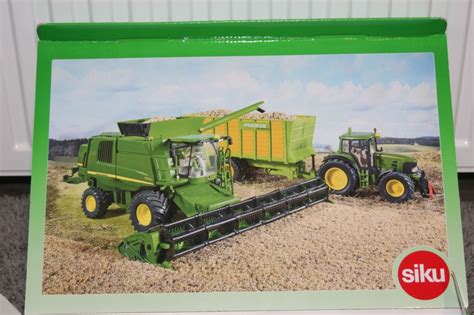 SIKU KOMBAJN JOHN DEERE T670i Seria Farmer 1 32 12892829511