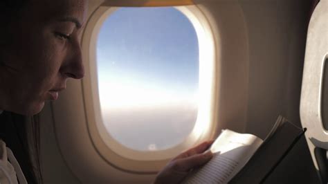 Woman Reading Book Inside Airplane Happy Traveler Reading A Book In An