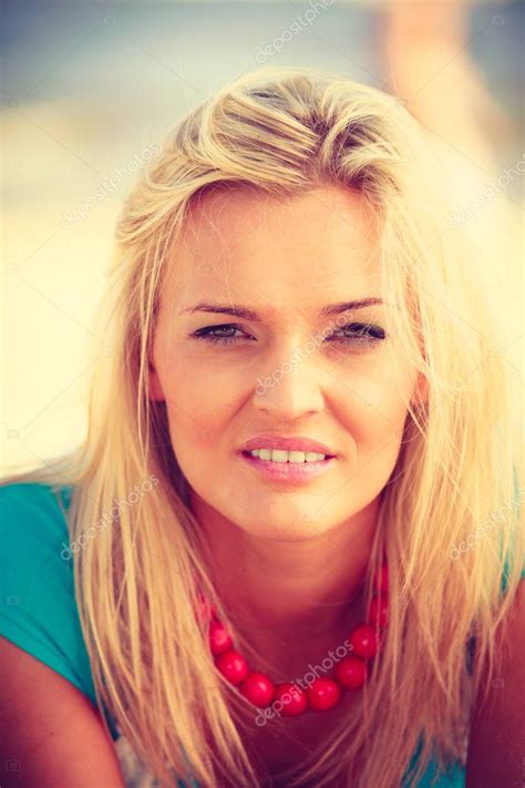 Blonde Woman Lying On Sand Stock Photo By Voyagerix