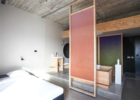 Hanna Maring S Volkshotel Suite Has A Wooden Bathtub And Colourful Screens Hotel Interiors