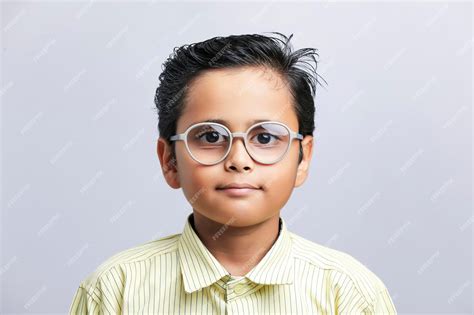 Premium Photo Indian School Boy In Uniform And Giving Expression