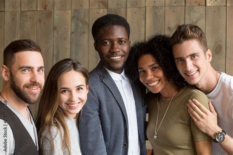 Portrait of happy multiracial people smiling at camera showing racial ...