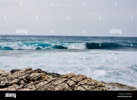 A Big Wave Overlaps The Coast Of The Croatian Island Of Losinj Rolling