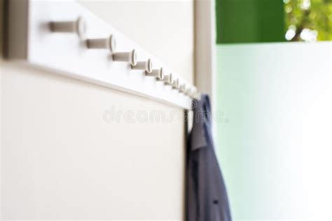 Simple White Wall Coat Hanger with a Hanging Shirt Stock Photo - Image ...