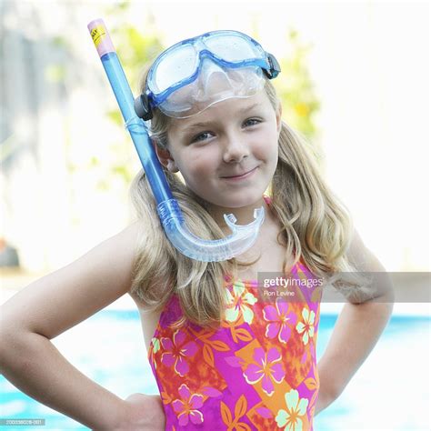 Girl Wearing Swimsuit And Snorkel In Front Of Pool Portrait High Res