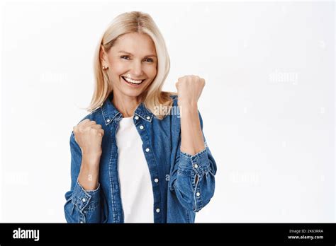 Yes Success Excited Blond Mature Woman Celebrating Makes Fist Pump And Smiles Satisfied