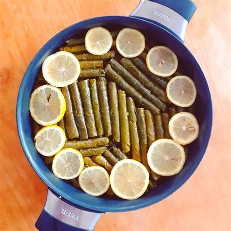 Lemons And Pickles In A Pan On A Table