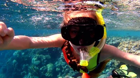 young-girl-snorkeling-in-the-red-sea-the-child-with-pleasure-swimming ...