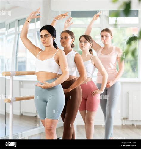 Group Of Positive Young Girls Engaged In Classical Ballet In Dance