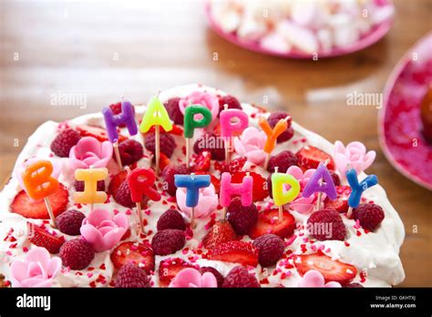 Colorful birthday cake with letters Stock Photo - Alamy