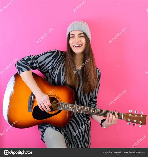 Teenage Girl Playing Acoustic Guitar