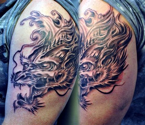 Dragon head tattoo by gettattoo on deviantART | Dragon head tattoo, Dragon tattoo arm, Arm tattoo