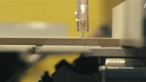 Close Up Of Cnc Milling Machine While Carving A Wooden Lumber In A