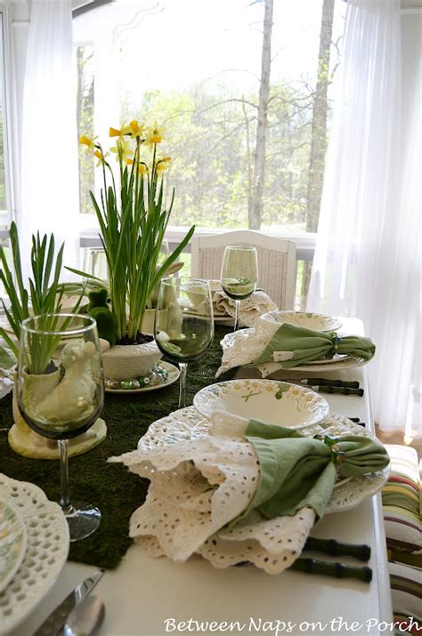 Easter Table Setting With Daffodil And Moss Centerpiece